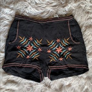 Black fabric high rise embroidered shorts
